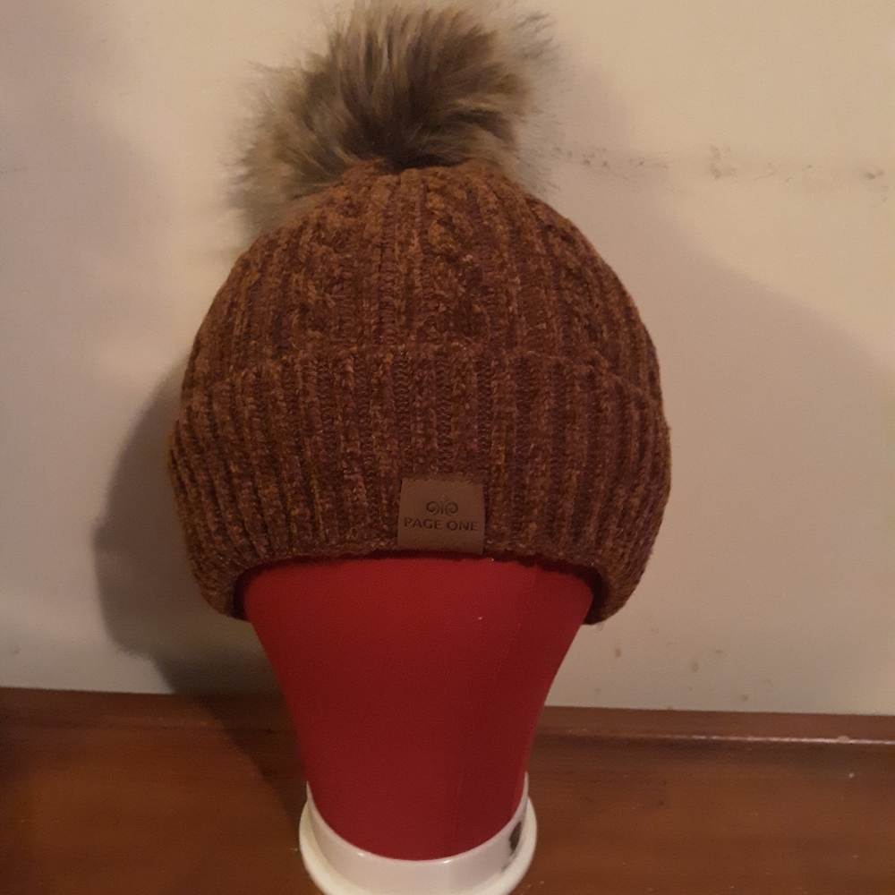 Brown lined winter hat hat with fluffy puff ball